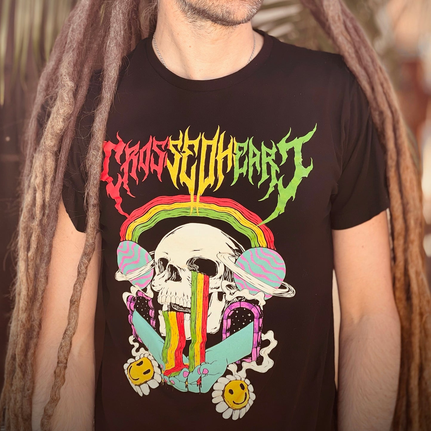 black sunshine and rainbows graphic t shirt with colorful skull rainbow artwork crossed heart clothing alternative streetwear close up design detail