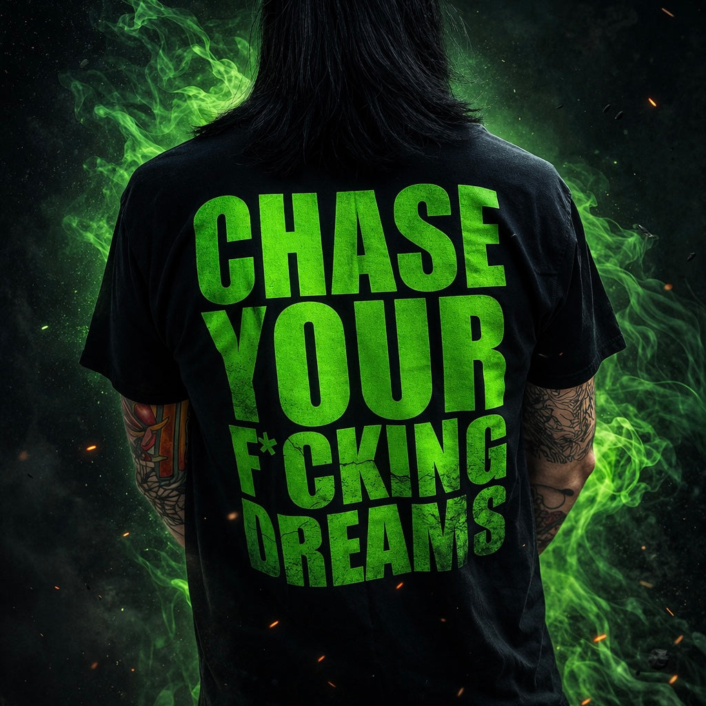person wearing black chase your dreams graphic t-shirt with bold green typography streetwear band merch lifestyle photo