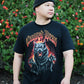 Person wearing black alternative streetwear t-shirt featuring flaming three-headed hellhound Dogs of War graphic by Crossed Heart Clothing outdoors