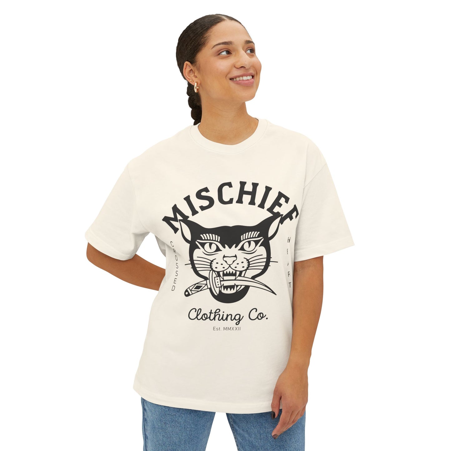 model wearing cream mischief oversized t shirt with cat graphic crossed heart clothing co relaxed fit streetwear tee