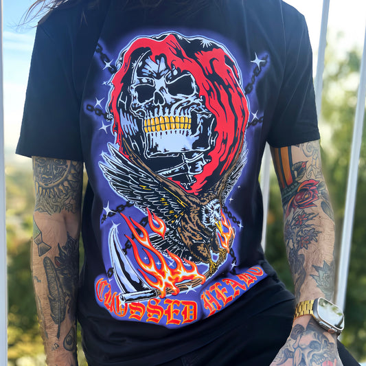 Model wearing black tattoo-inspired skull graphic alternative streetwear t-shirt with eagle and flames by Crossed Heart Clothing