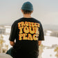 person wearing black protect your peace graphic t shirt with yellow and red retro text back print streetwear lifestyle photo