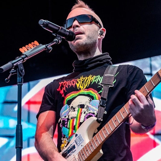 black sunshine and rainbows graphic t shirt with skull rainbow design crossed heart clothing worn on stage live performance lifestyle photo