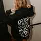 person wearing true to the crew crossed heart black hoodie with oc ca crossed swords graphic tattoo inspired alternative streetwear hoodie
