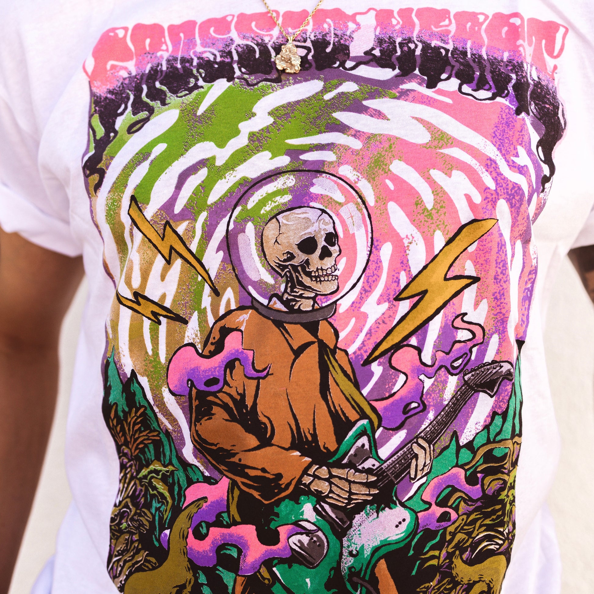 Close-up of Underwater graphic t-shirt featuring psychedelic skeleton astronaut playing guitar artwork in tattoo inspired alternative streetwear design by Crossed Heart Clothing